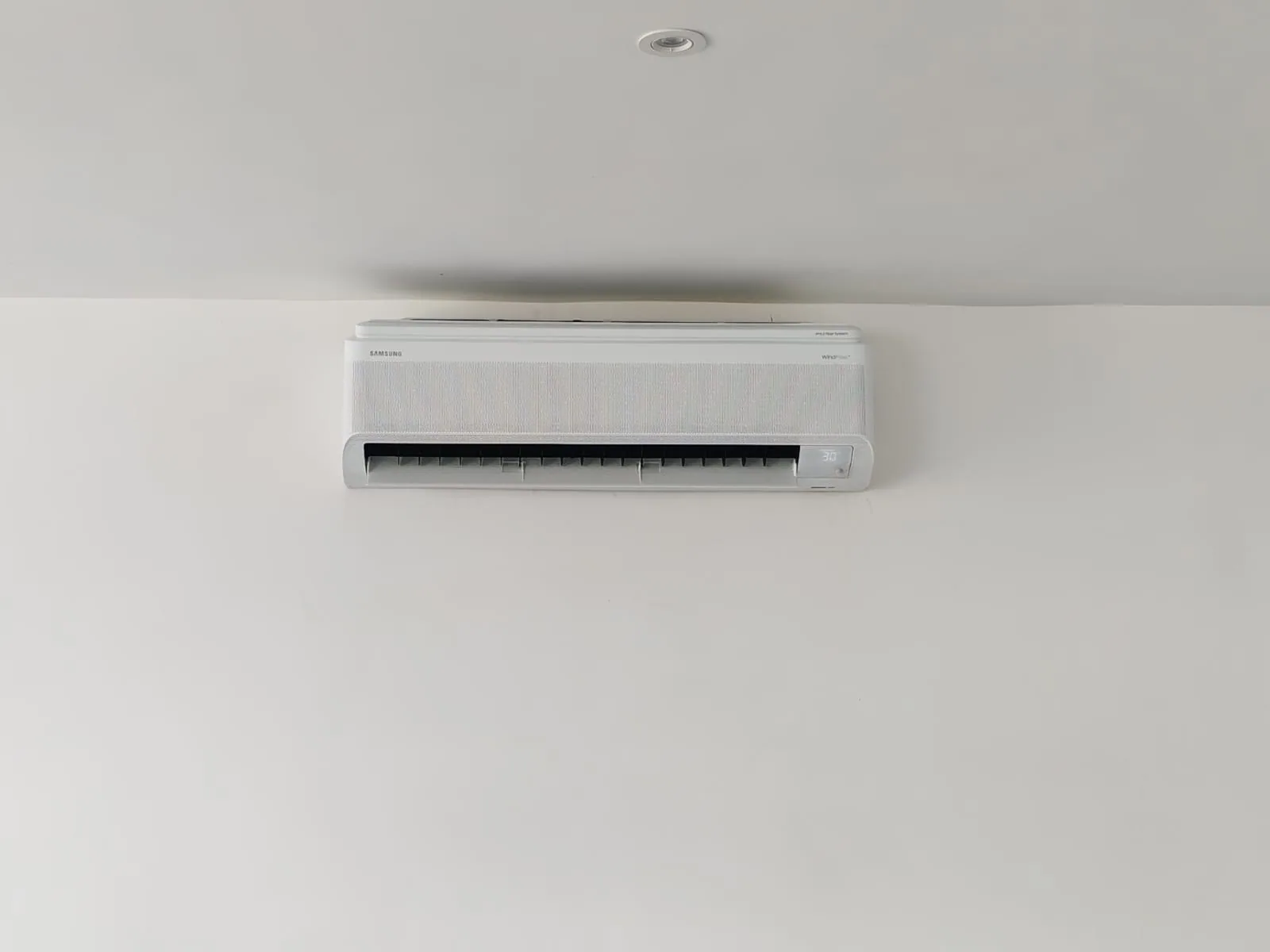 Front view of a wall-mounted split air-conditioning unit.